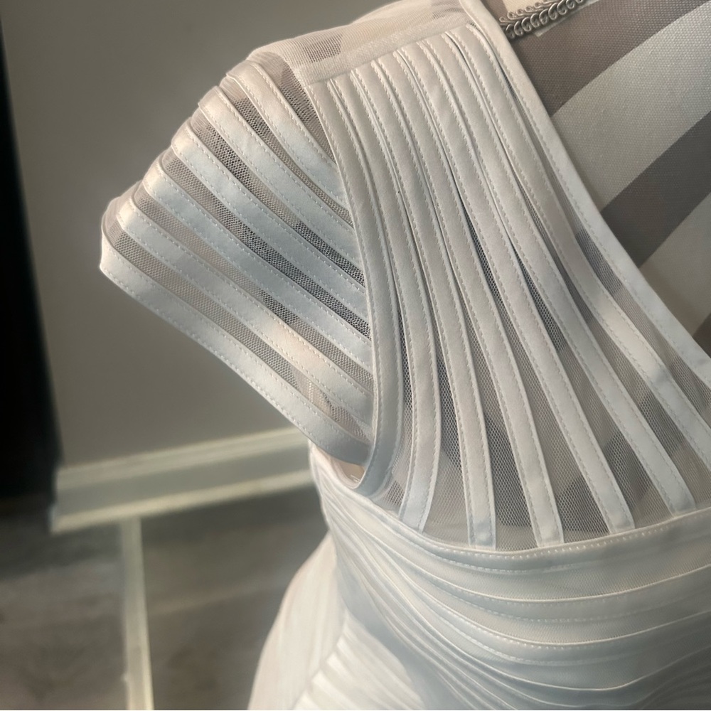 White ribbon dress? It hugs your boddy, great for engagement, wedding, proposal